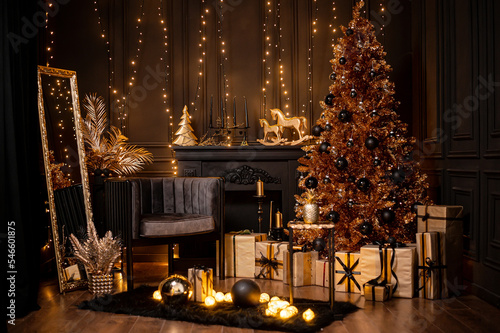 Merry Christmas and Happy Holidays!Beautiful black modern living room decorated for Christmas.Chrystmas Luxury black style living room interior with sofa decorated chic , golden style.Selective focus.