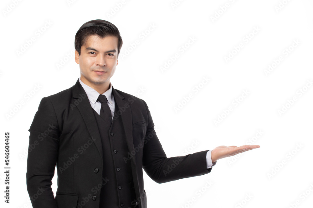 Businessman smiling, holding open palm with empty copy space. Business man showing hand sign to side concept of advertisement product isolated on white background. Businessman smiling, holding open palm with empty copy space. Business man showing hand sign to side concept of advertisement product isolated on white background.