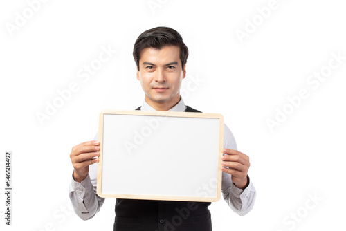 Portrait of happy smiling young businessman showing blank signboard with copyspace for text isolated on white background.