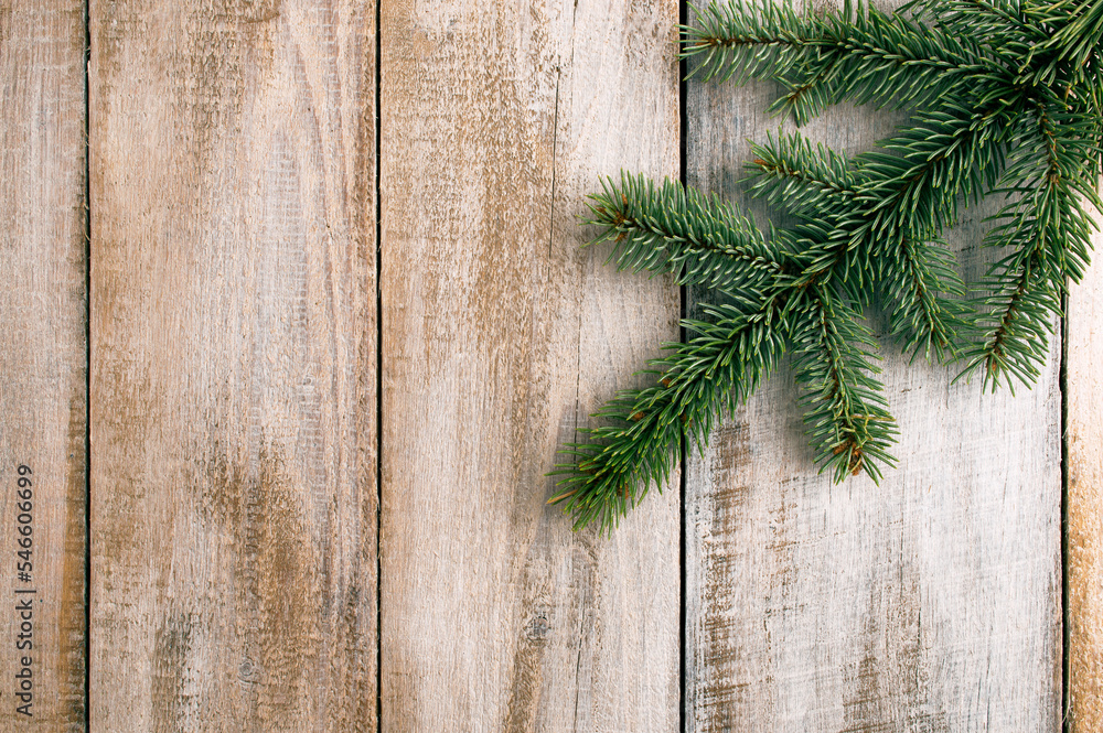 Pine tree branches, xmas symbol year celebration. Green fir branches on a wooden background. Christmas. Winter. Flat lay Pine tree branches, xmas symbol year celebration. Green fir branches on a wooden background. Christmas. Winter. Flat lay