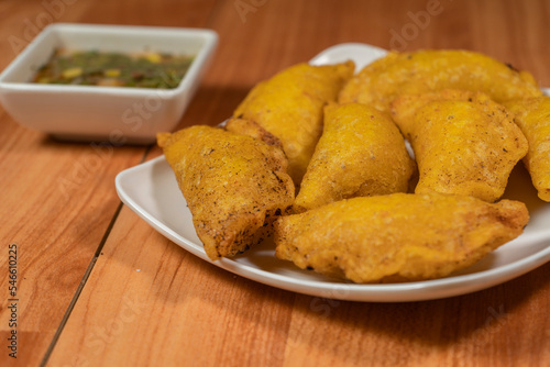 Colombian empanada with spicy sauce