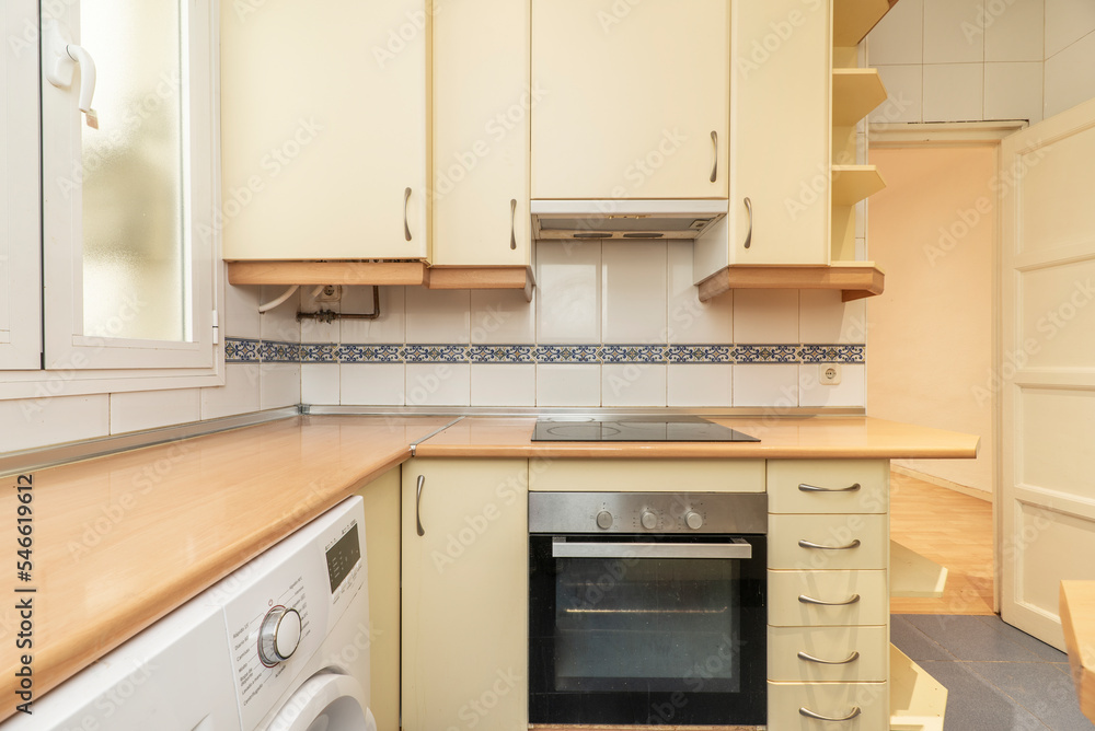 Kitchen with soft yellow cabinets and beech countertops Kitchen with soft yellow cabinets and beech countertops