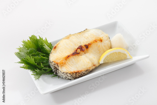 Grilled black cod or Gindara fish in plate on white background.