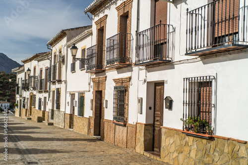 The historic center of the old town of Antequera. Historic brick church. small white buildings and narrow streets. horizontal, daylight