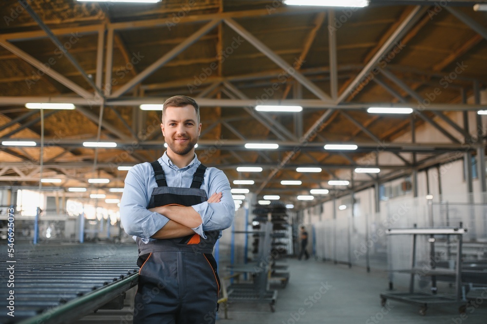 Portrait of factory worker. Young handsome factory worker. Portrait of factory worker. Young handsome factory worker.