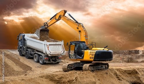  excavator is digging and loading at construction site