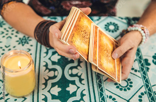 Photography A fortune teller reads with tarot cards. Selective focus.