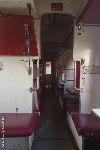Soviet couchette car is a railway carriage conveying non or semi-private sleeping accommodation. The inscription on the sign translates to "Emergency exit"  