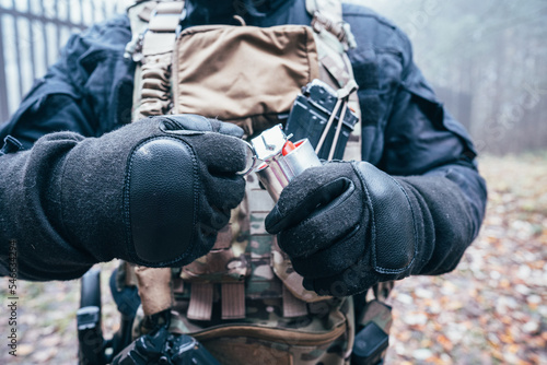 A grenade in the hand of a soldier