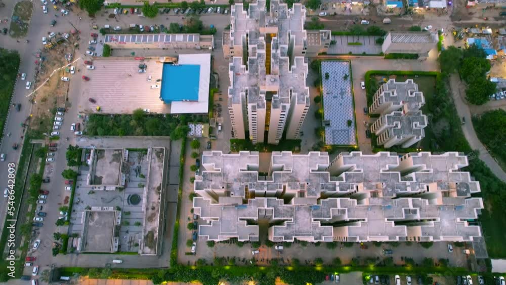 panning up aerial drone shot going from high rise skyscraper condo society to commercial buildings markets and more in gurgaon, delhi, bangalore showing the real estate housing in India panning up aerial drone shot going from high rise skyscraper condo society to commercial buildings markets and more in gurgaon, delhi, bangalore showing the real estate housing in India
