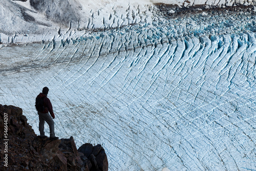 A hiker looks over the Piedras Blancas glacier. photo