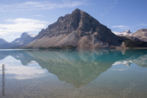 Reflection of mountain and ranges in Bow Lake photo