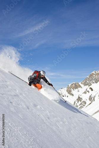 A young man skis untracked powder off-piste at St. Anton am Arlberg, Austria. photo