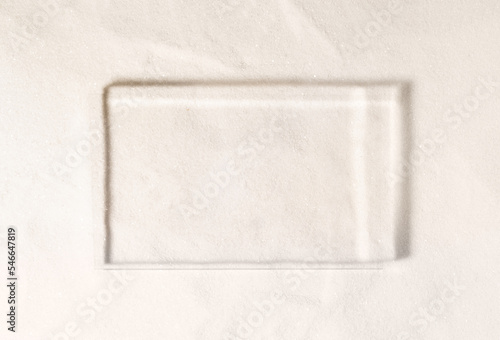 Картината върху платно Minimal nature scene, empty mockup frame for product presentation made with transparent glass with sun reflection on a sand