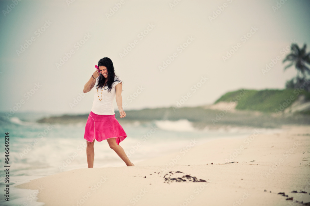 A young woman on a beach in the Bahamas A young woman on a beach in the Bahamas