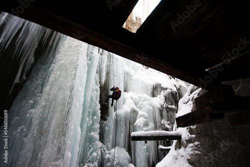 A Man Rappelling From An Icefall photo