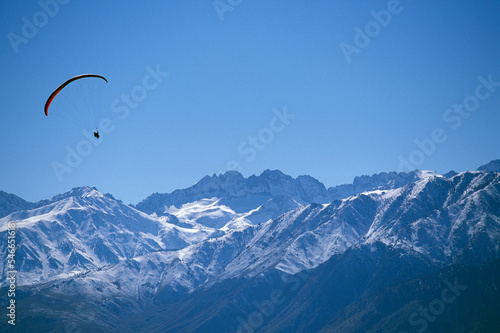 Paraglider flying in Owens Valley, California. photo