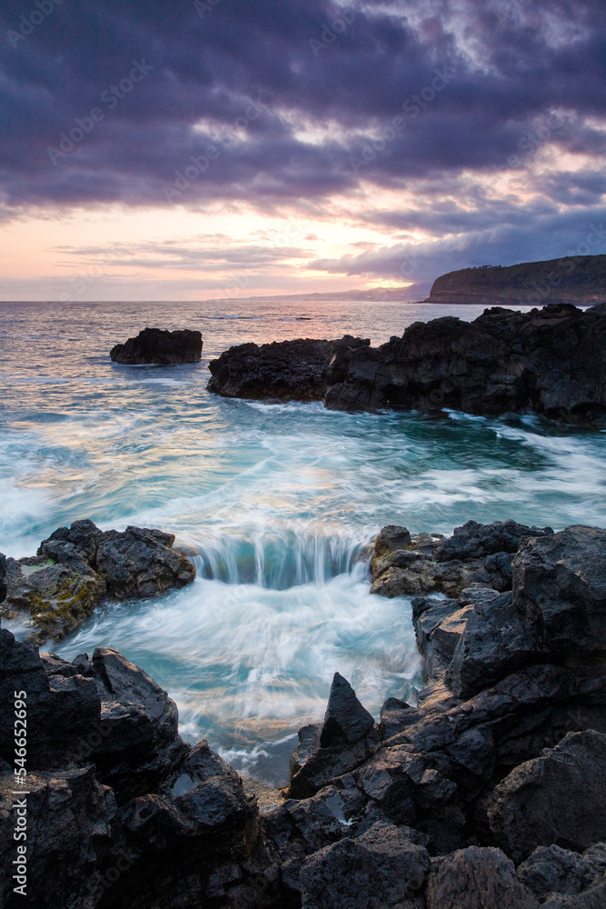 Waves from the Atlantic ocean crash and flow around the rock formations at one of Saint Michael's Island beaches. Waves from the Atlantic ocean crash and flow around the rock formations at one of Saint Michael's Island beaches.