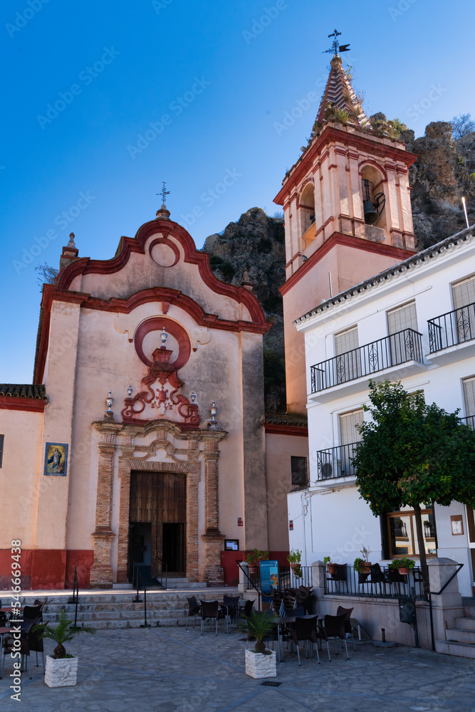 Obraz premium The Baroque church of Santa Maria de la Mesa has a pink marble main façade and a bell tower that can be seen from all over the town, Andalusia, Spain