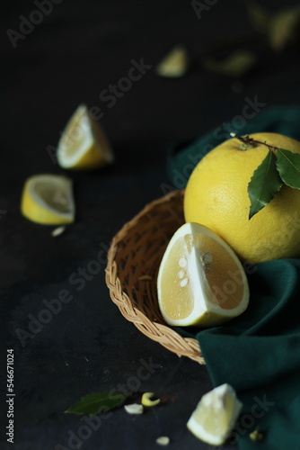 Grapefruit in a basket, a minimalist still life composition in a dark style.