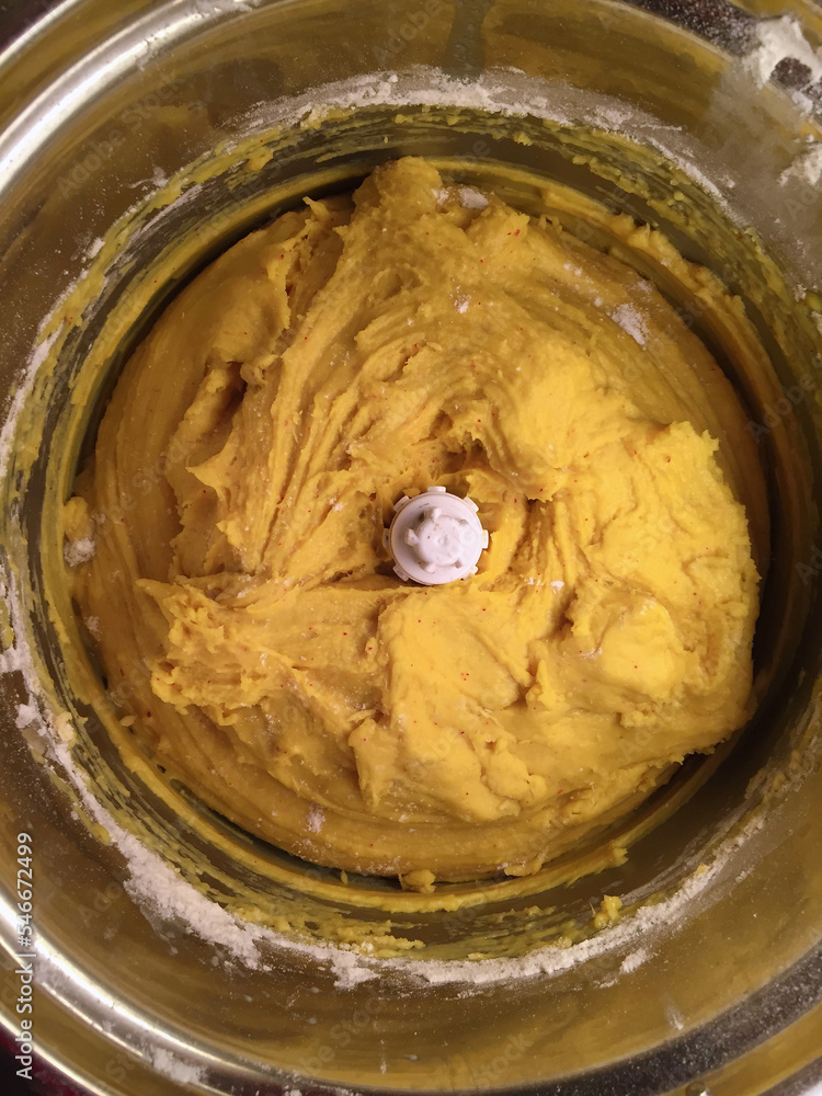 Homemade saffron dough in a food processor for baking buns for December holidays. Homemade saffron dough in a food processor for baking buns for December holidays.