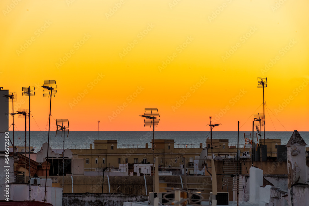 Colorful sunset over the historic center of the ancient city of Cádiz in Andalusia Spain