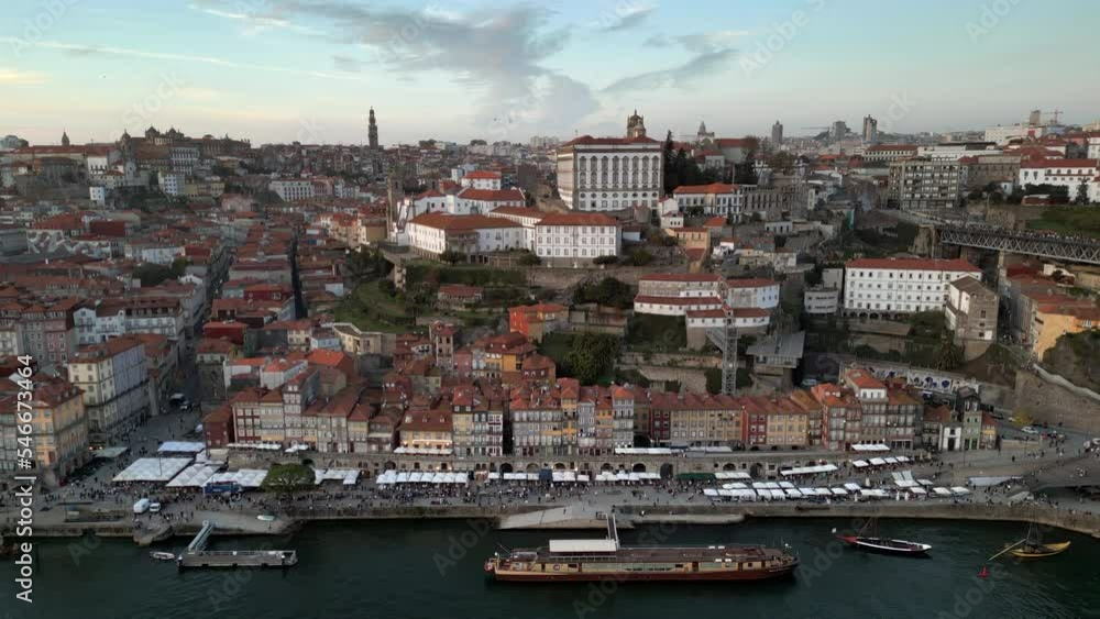 Aerial panoramic view of Porto cityscape showing the historic district and Ribeira Waterfront (Cais da Ribeira) at dusk in Porto (Oporto), Portugal. Aerial panoramic view of Porto cityscape showing the historic district and Ribeira Waterfront (Cais da Ribeira) at dusk in Porto (Oporto), Portugal.
