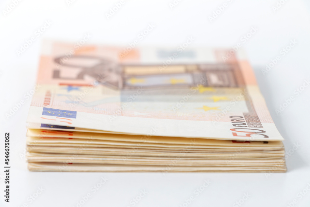 stack of paper money with 50 euro banknote, selective focus