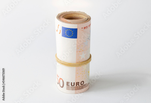rolled up money, 50 euro banknote isolated on white background
