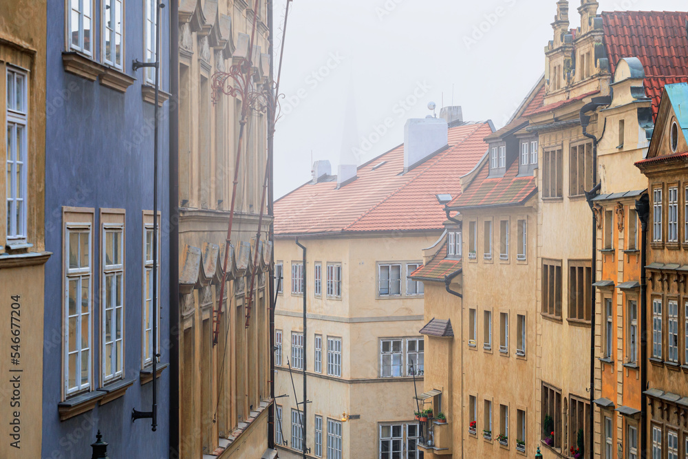 Cityscape on a foggy morning - view of Mala Strana historical neighbourhood of Prague, Czech Republic
