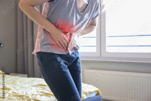 woman holding his stomach, digestive problems, gastritis, intestinal problems, liver failure