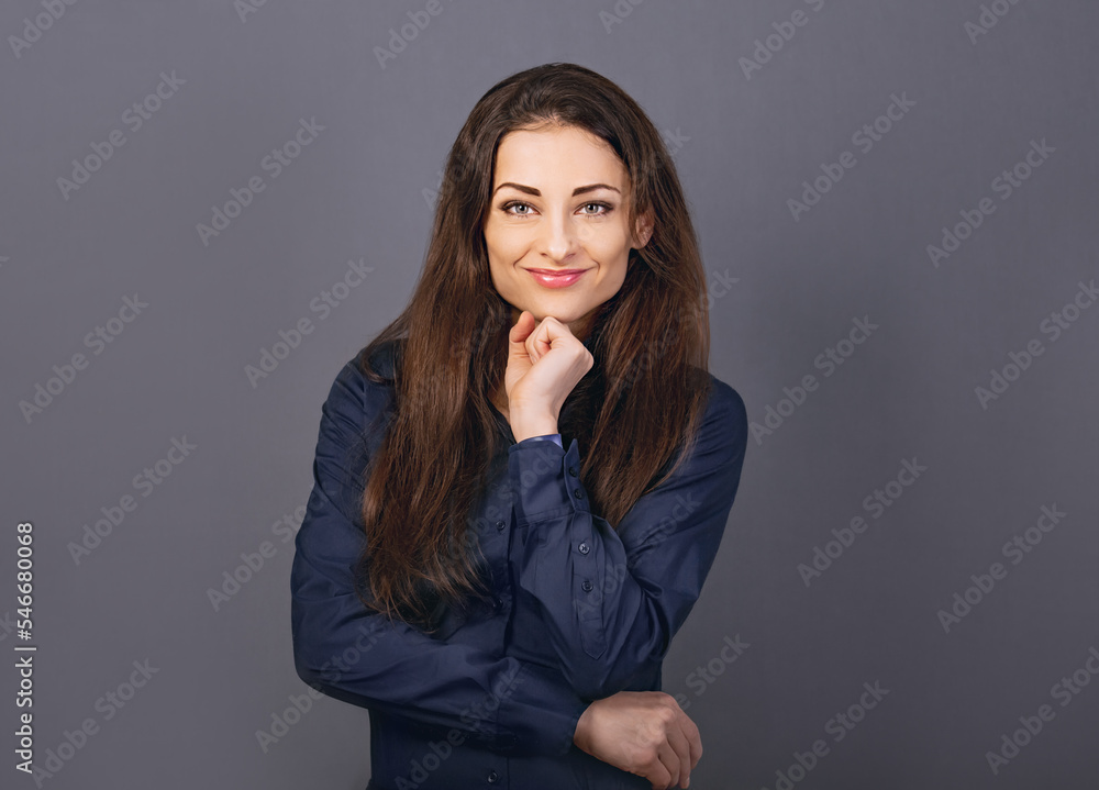 Beautiful confident happy smiling business woman with folded arms in blue shirt on grey background with empty copy space for text. Closeup Beautiful confident happy smiling business woman with folded arms in blue shirt on grey background with empty copy space for text. Closeup