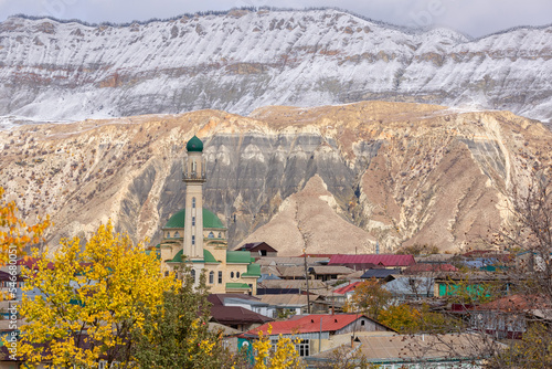 Panoramic view of Salta village, Dagestan, Russia. Mosque and houses in a small mountain village. Minaret on the background of mountains. photo