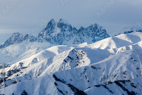 Two-peaked mountain Ushba, challenging mountain of Caucasus, among the mountains of the Main Caucasian Mountain Range, Svaneti, Georgia