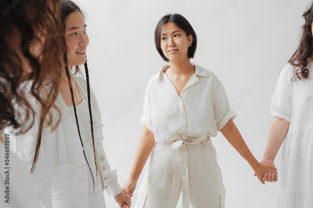 asian women stand in a circle holding hands asian women stand in a circle holding hands