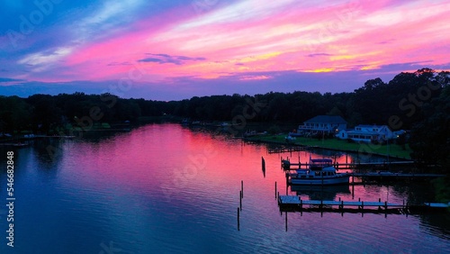 Drone shot of a boat docked on the Chesapeake shore of the bay Deale MD at sunset photo