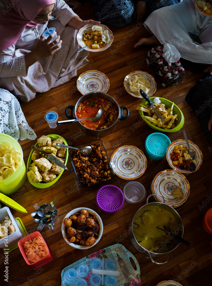 High angle view of family enjoying lunch together during celebration High angle view of family enjoying lunch together during celebration