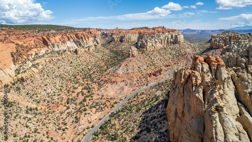 The East Burr Trail Road winding through the red rock walls of Long Canyon, Utah, USA