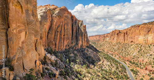 The East Burr Trail Road winding through the red rock walls of Long Canyon, Utah, USA