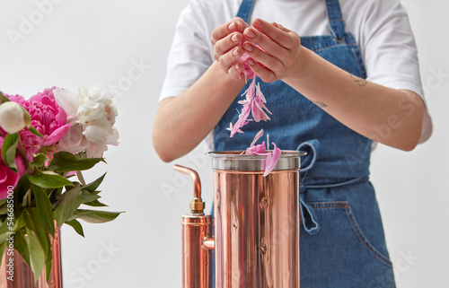 Perfumer working on oil distilling