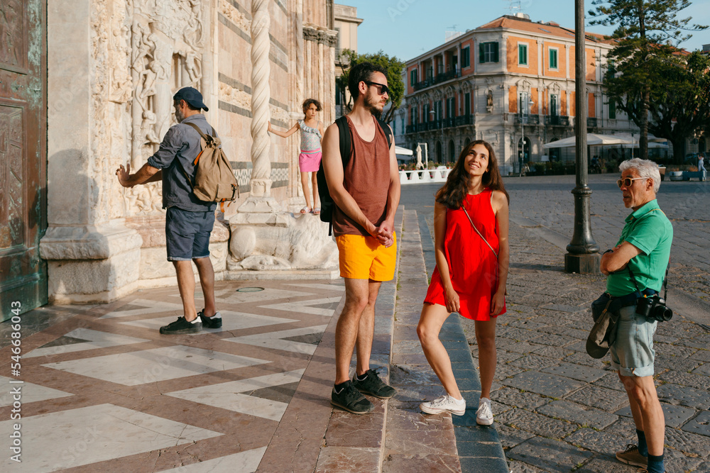 Multigenerational group of tourists chatting in italian city Multigenerational group of tourists chatting in italian city