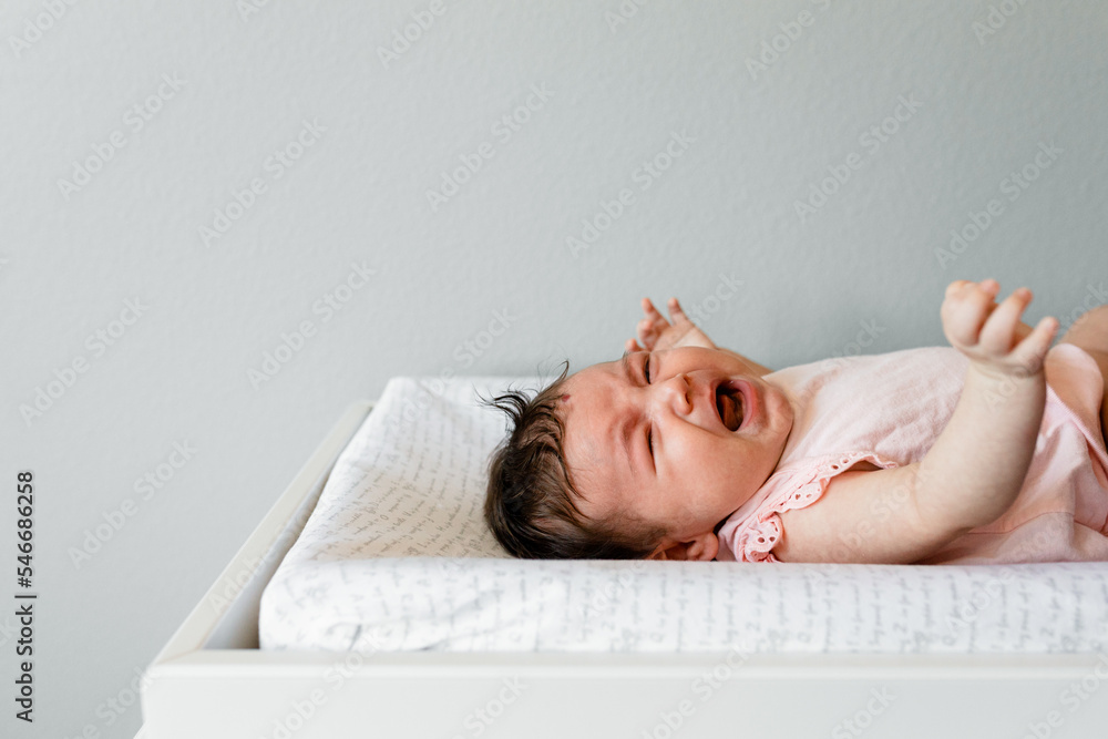 Infant Cries During A Diaper Change Stock Photo Adobe Stock
