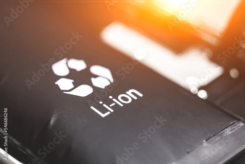 Swollen lithium-ion battery, modern smartphone, broken smartphone, battery-powered explosive electronics