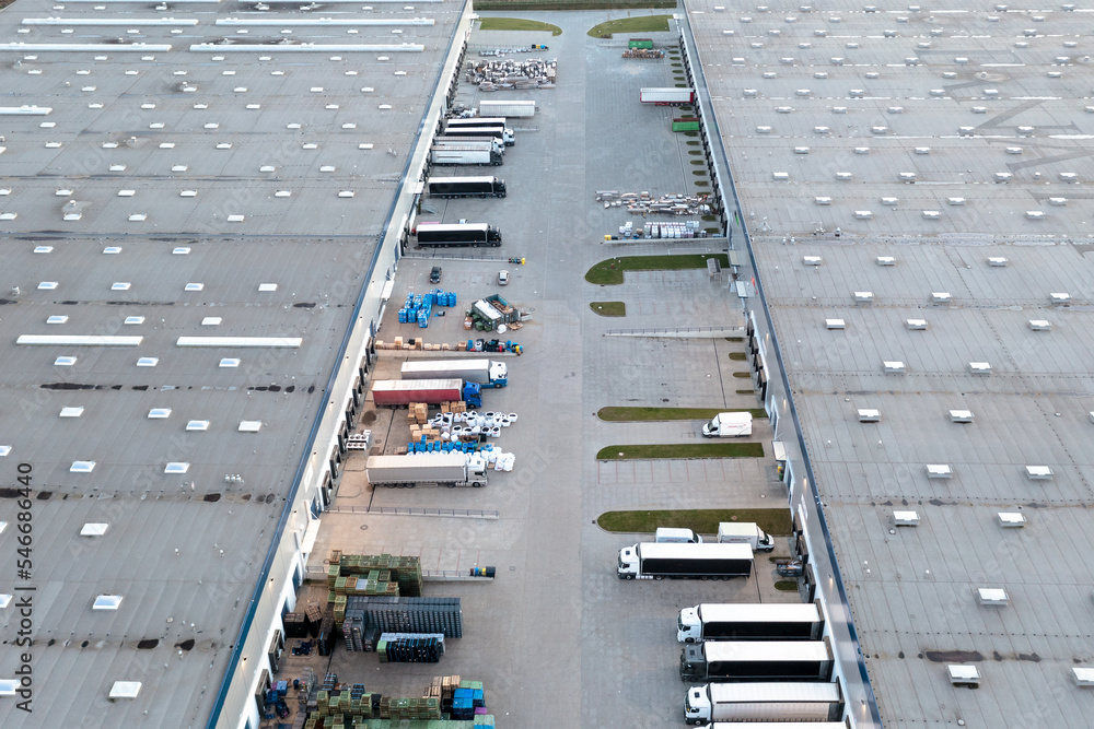 Aerial view of loading trucks in the logistics center of a large transport company