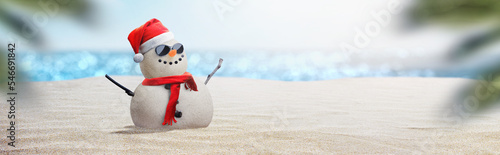 snowman with sunglasses on sunny beach - beach christmas concept