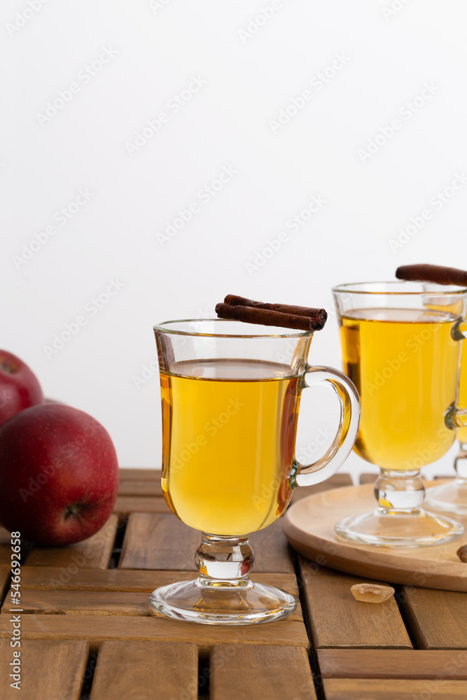 apple cider on a wooden table apple cider on a wooden table