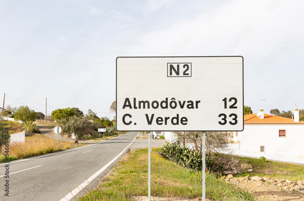 Obraz premium N2 (EN2 - Estrada Nacional 2) signpost at Dogueno with distances to Almodôvar and Castro Verde, Alentejo, Portugal