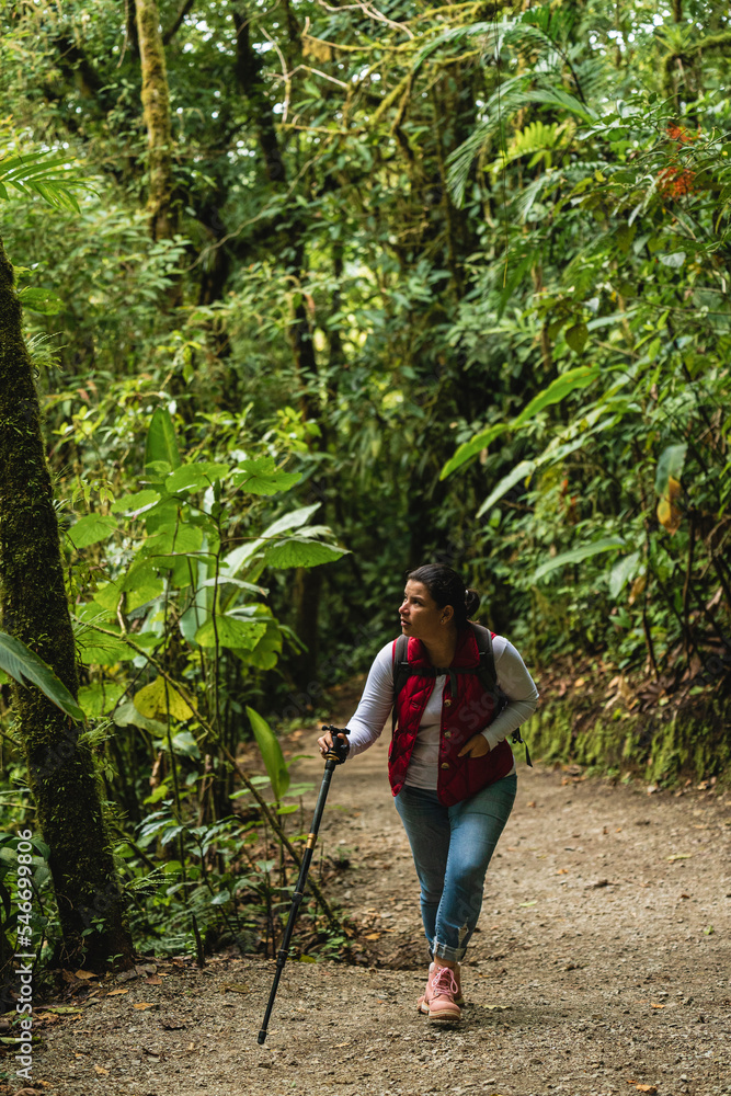 Woman walking on a trail. Woman walking on a trail.
