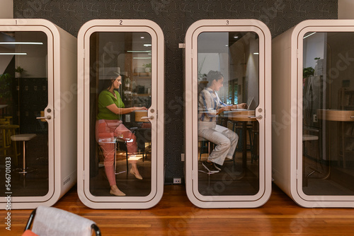 Coworkers using private cabins