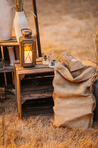 outdoor still life with candle and burlap bag photo
